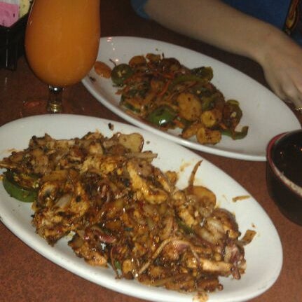 Photo taken at bd&#39;s Mongolian Grill by Cameron J. on 6/27/2012