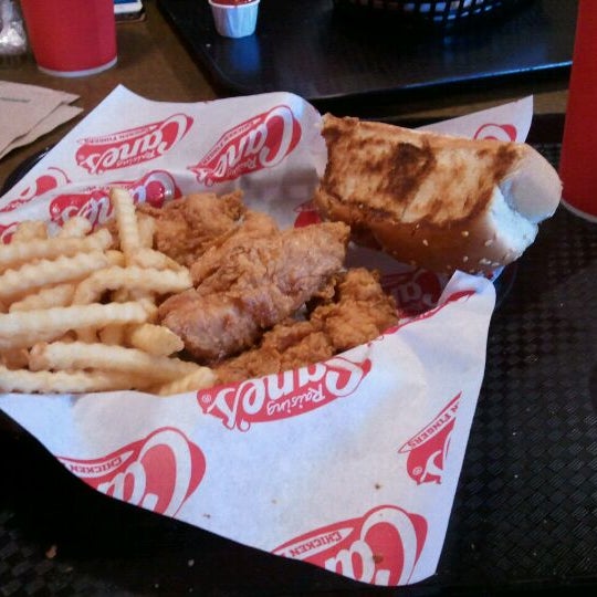 Photo taken at Raising Cane&#39;s Chicken Fingers by Leah P. on 12/6/2011