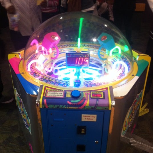 The easiest game in the arcade for earning tickets quickly is cyclone. It's all about the timing!