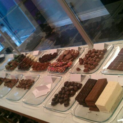 Photo taken at Sinful Sweets Chocolate Company by Christopher W. on 11/21/2011