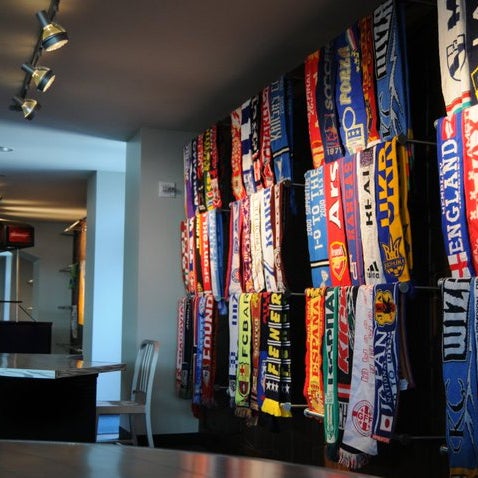 Have an extra soccer scarf? Add it to the collection in the Members Club where scarfs from around the world adorn the wall.