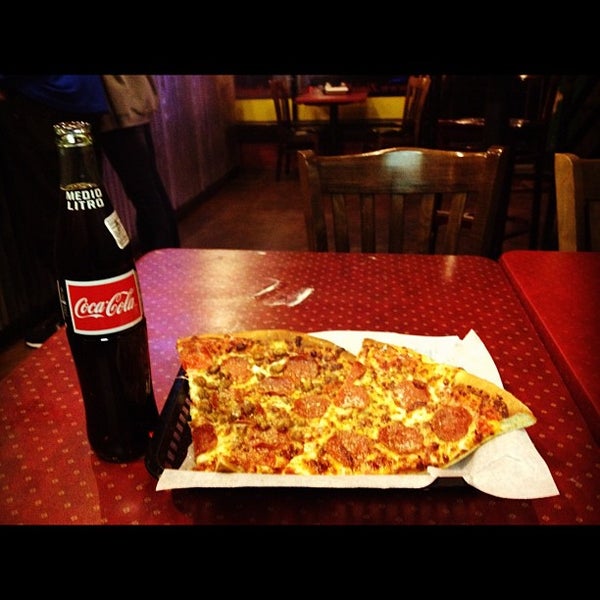 Photo taken at Zini&#39;s Pizzeria by John S. on 2/25/2012