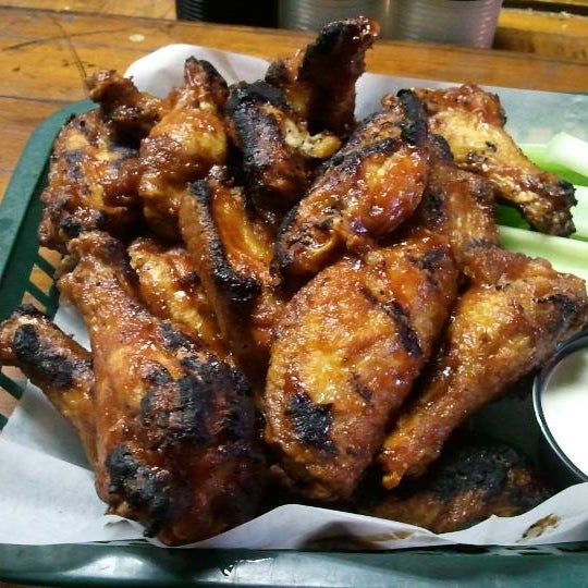Order wings with the works! First deep fry, then sauce, and then grill to crispy!