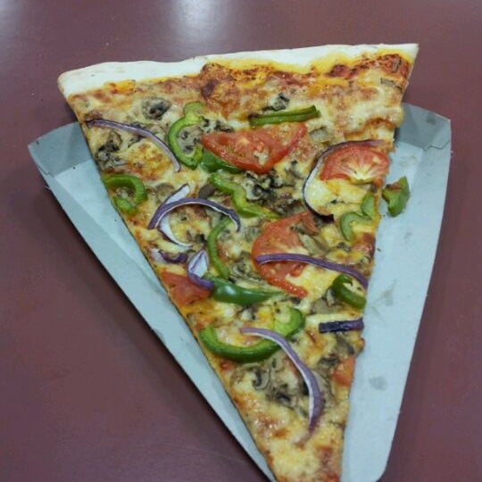 Foto diambil di Big Slice Pizza oleh Tyler M. pada 4/28/2012