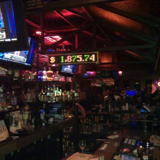 Foto diambil di Tommy Rocker&#39;s Mojave Beach Bar &amp; Grill oleh Demont D. pada 11/18/2011