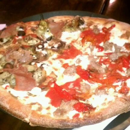 Photo taken at Goodfella&#39;s Woodfired Pizza Pasta Bar by Maegan B. on 2/1/2012