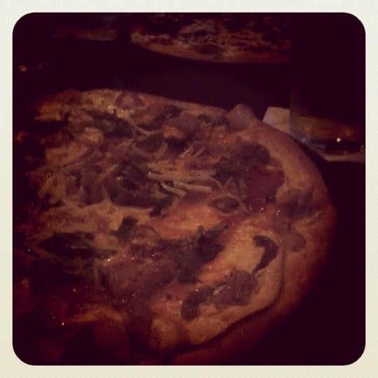 Photo taken at Goodfella&#39;s Woodfired Pizza Pasta Bar by Chris C. on 3/3/2011