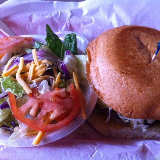 Photo taken at Moonies Burger House by Teresa C. on 5/1/2012