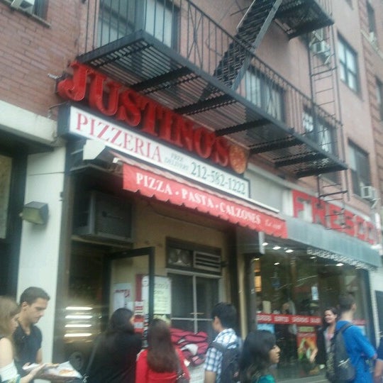Photo taken at Justino&#39;s Pizzeria by Natalie M. on 9/5/2012