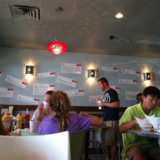 Photo taken at Juicy Burgers &amp; Dogs by Ryan M. on 8/10/2011