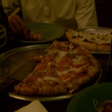 Photo taken at Buenos Aires Pizzeria by Mitch C. on 1/1/2012
