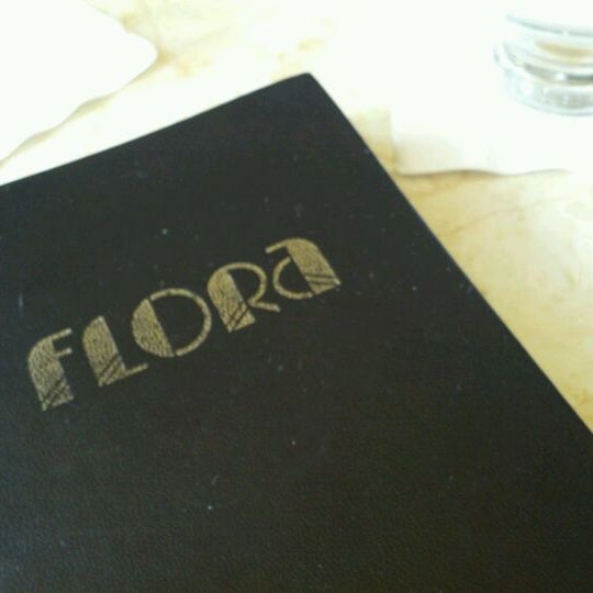 Photo taken at Flora Restaurant &amp; Bar by Martin K. on 4/25/2012