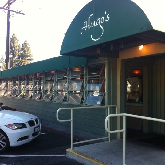 Photo taken at Hugo&#39;s Restaurant by Sabina K. on 7/22/2011