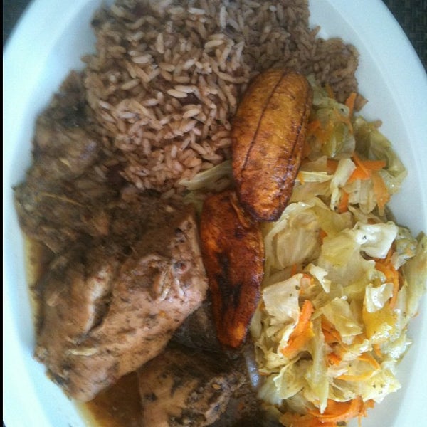 Photo taken at Ackee Bamboo Jamaican Cuisine by Chris L. on 9/1/2012