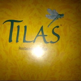 Photo taken at Tila&#39;s Restaurante &amp; Bar by Huy N. on 11/26/2011