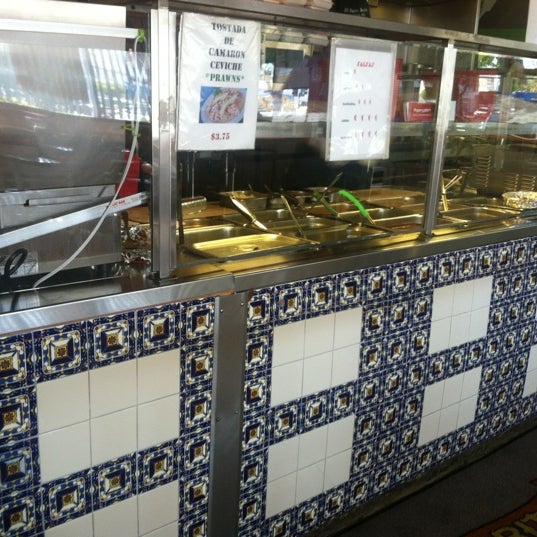 Photo taken at El Super Burrito by Gabriela R. on 8/15/2012