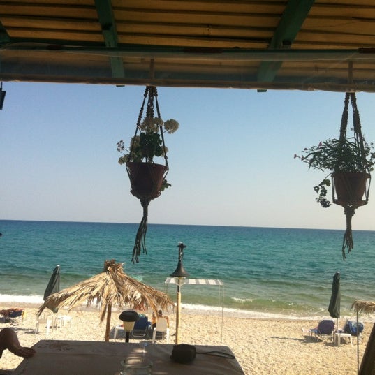 Photo taken at Stelakis Beach by Katerina Z. on 7/18/2012