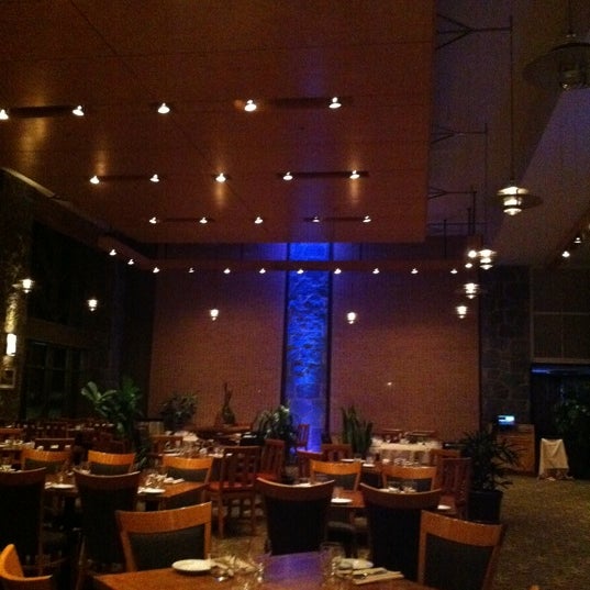 Photo taken at The Aubergine Bar &amp; Grille by Samy T. on 1/25/2012