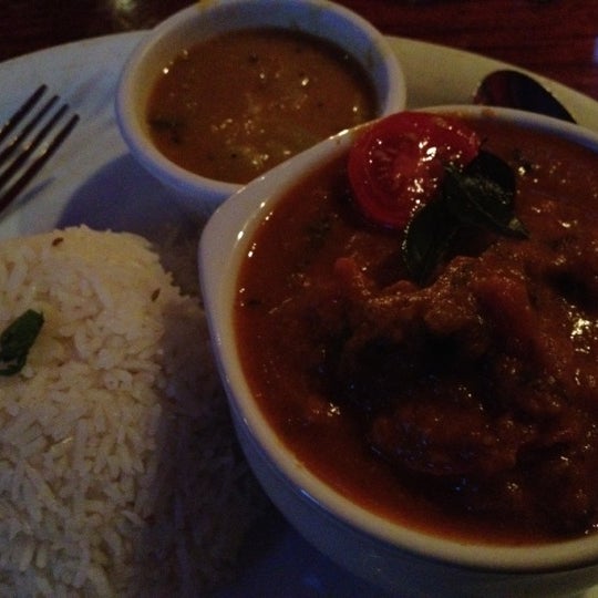 Photo taken at Mela Indian Restaurant by Eddie Y. on 8/4/2012