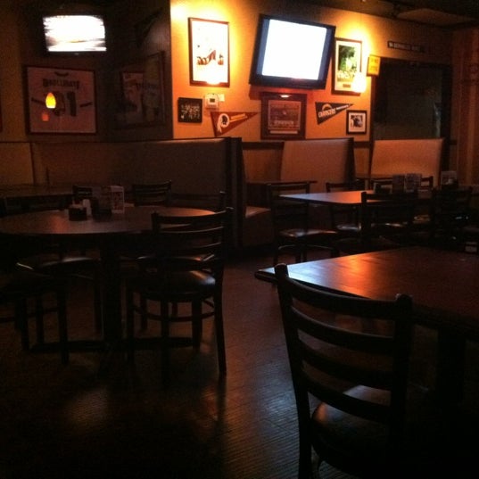 Photo taken at Mulligans Bar &amp; Grill by Mulligans A. on 2/19/2012