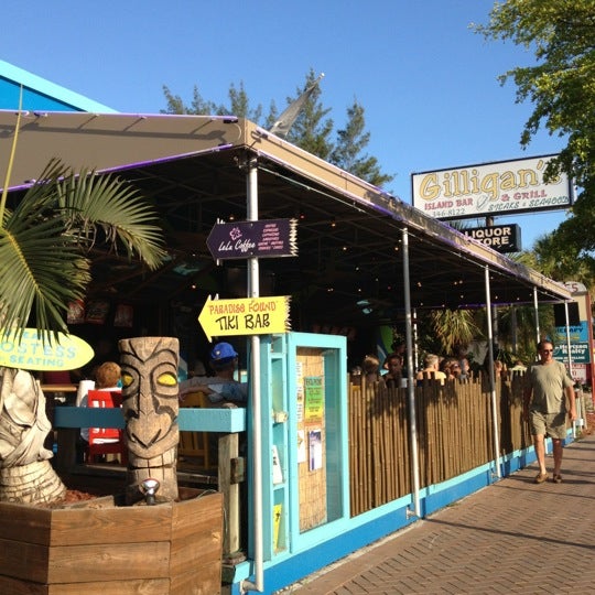 Photo taken at Gilligan&#39;s Island Bar and Grill by Frank C. on 5/25/2012