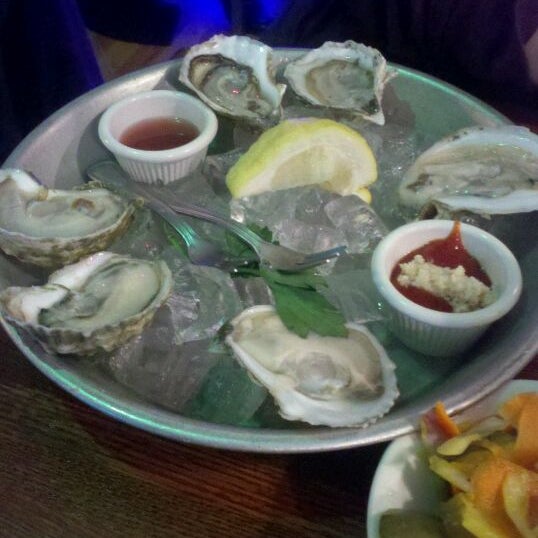 Photo taken at East Coast Grill &amp; Raw Bar by Alicia V. on 5/2/2012