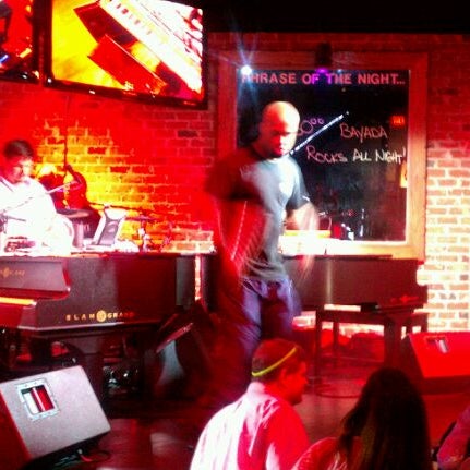 Photo taken at Bobby McKey&#39;s Dueling Piano Bar by Eric H. on 6/2/2012