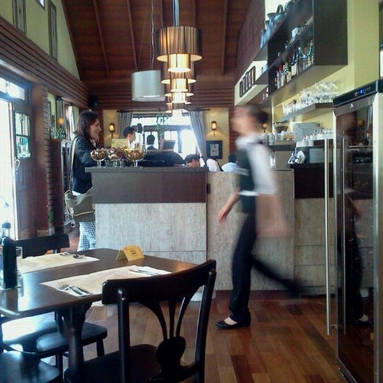 Photo taken at PaneOlio Ristorante &amp; Caffe by Kelly K. on 11/21/2011