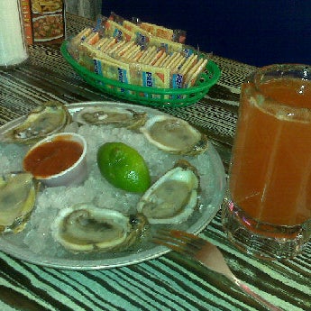 Photo taken at Mambo Seafood by Mateo B. on 12/4/2011