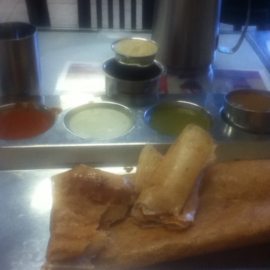 Photo taken at Madura Indian Vegetarian Cuisine by teija a. on 4/16/2012