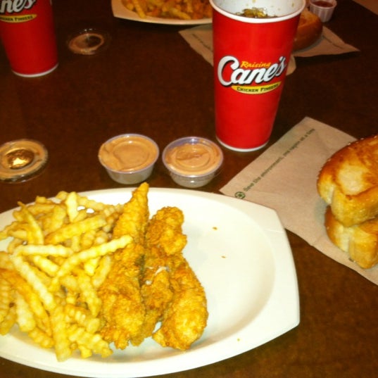 Photo taken at Raising Cane&#39;s Chicken Fingers by Logan D. on 7/24/2012