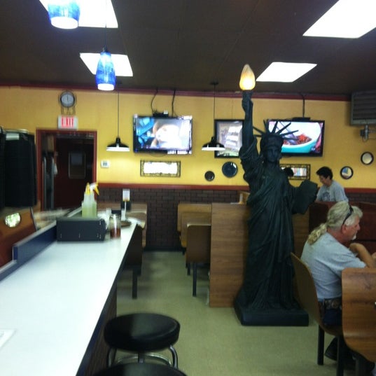 Photo taken at Brothers N.Y. Style Pizzeria by Joshua G. on 6/26/2012