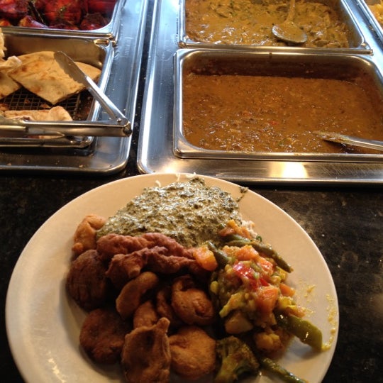 Photo taken at Mogul Indian Restaurant by NICK S. on 1/4/2012