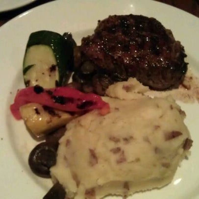 Photo taken at The Keg Steakhouse + Bar - Windsor Riverside by Jannine A. on 10/8/2011