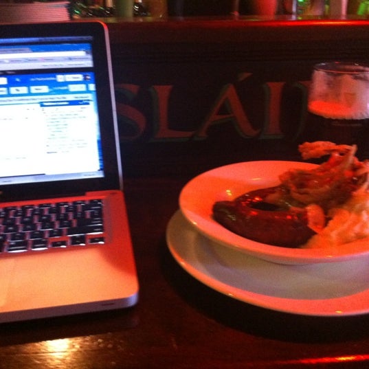 Photo taken at Slainte Irish Pub + Kitchen by Jim T. on 8/22/2012