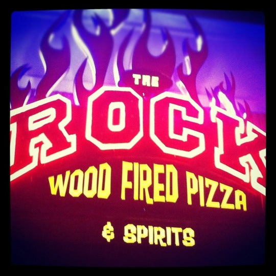 Photo taken at The Rock Wood Fired Pizza by Katie B. on 12/27/2011