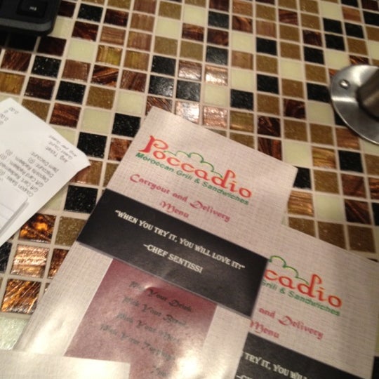 Photo taken at Poccadio Moroccan Grill &amp; Sandwiches by Reggie on 5/1/2012