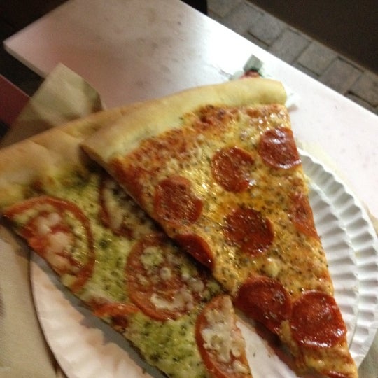 Photo taken at Slices Pizza by Antonino N. on 3/25/2012