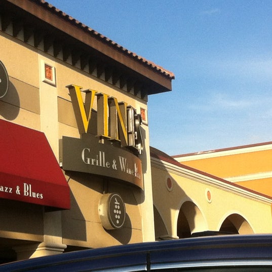 Photo taken at Vines Grille &amp; Wine Bar by André M. on 2/23/2012