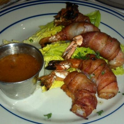 Photo taken at Sangria Tapas Bar &amp; Restaurant by Chris L. on 3/24/2012