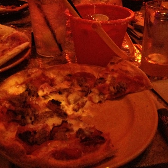 Photo taken at The Rock Wood Fired Pizza by Scott C. on 8/30/2012