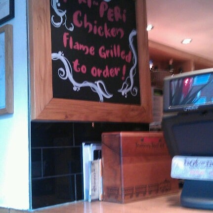 Photo taken at Nando&#39;s by Mark H. on 7/11/2012