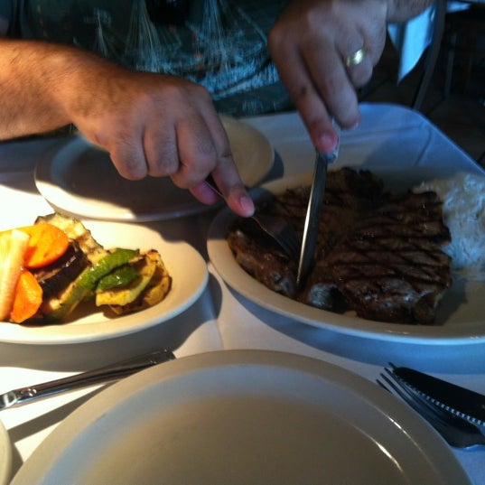 Photo taken at New Campo Argentino Steakhouse by Danielle P. on 5/23/2012