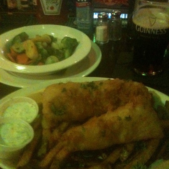 Photo taken at Slainte Irish Pub + Kitchen by Bip C. on 4/20/2012