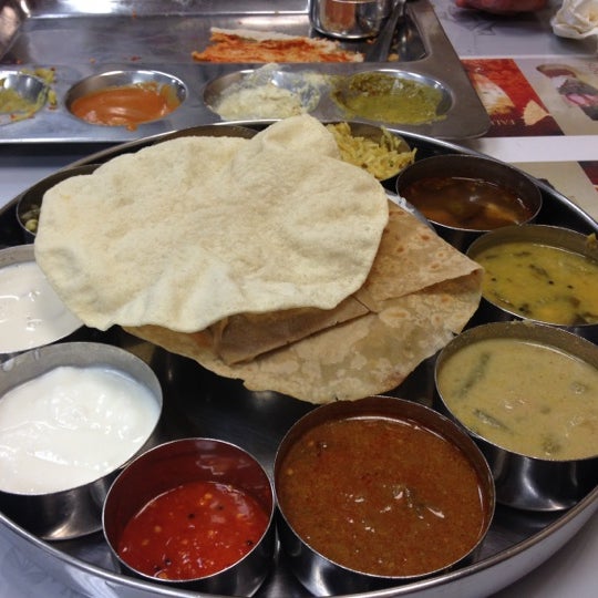 Photo taken at Madura Indian Vegetarian Cuisine by Nicole S. on 5/21/2012