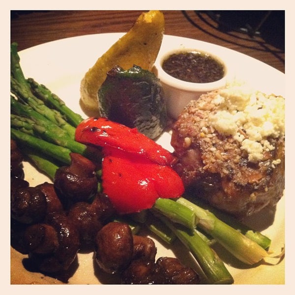 Photo taken at The Keg Steakhouse + Bar - Waterloo by Aubrey G. on 5/15/2012