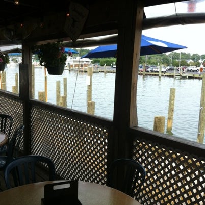 Photo taken at Harborside Bar &amp; Grill by Jake C. on 8/21/2012