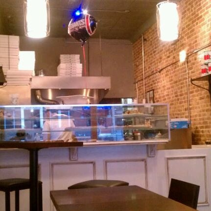 Photo taken at Ramagi Brick Oven Pizza by Milly I. on 2/8/2012