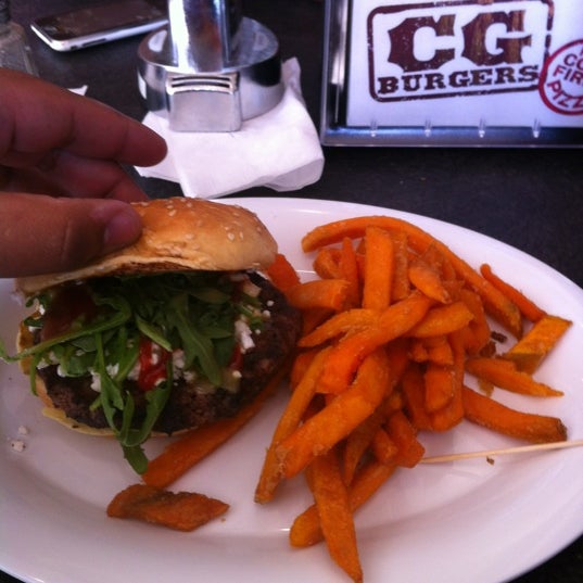 Photo taken at CG Burgers-Merrick by Gabriel G. on 4/13/2012