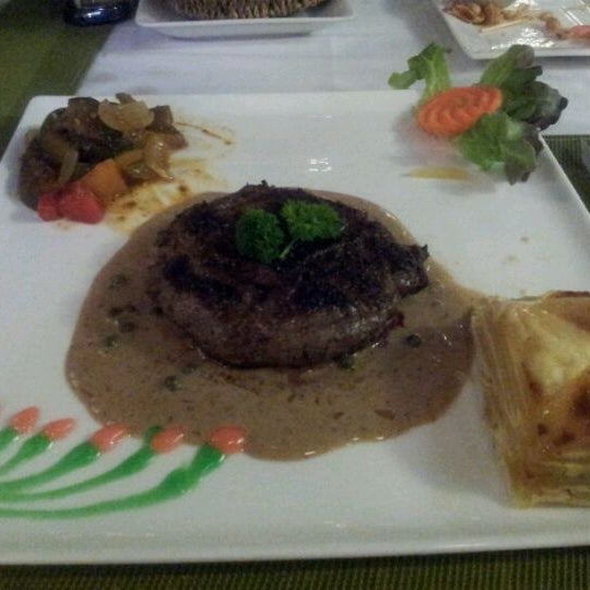 Photo taken at La Paillote French and Thai Restaurant by David S. on 2/3/2012